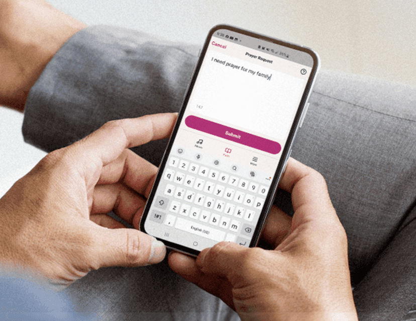 person holding a mobile phone submitting a prayer in the air1 app