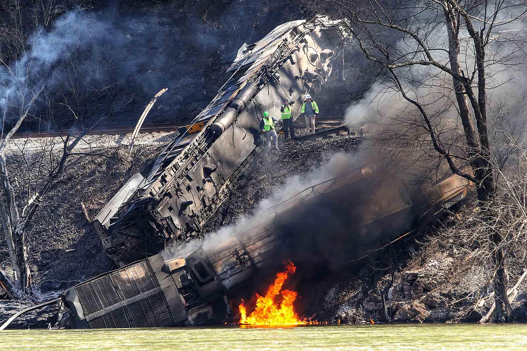 Smoke fills the sky after an empty CSX coal train hit a rockslide along tracks causing a fiery derailment on Wednesday, March 8, 2023 in a remote area just south of Sandstone, W.Va.