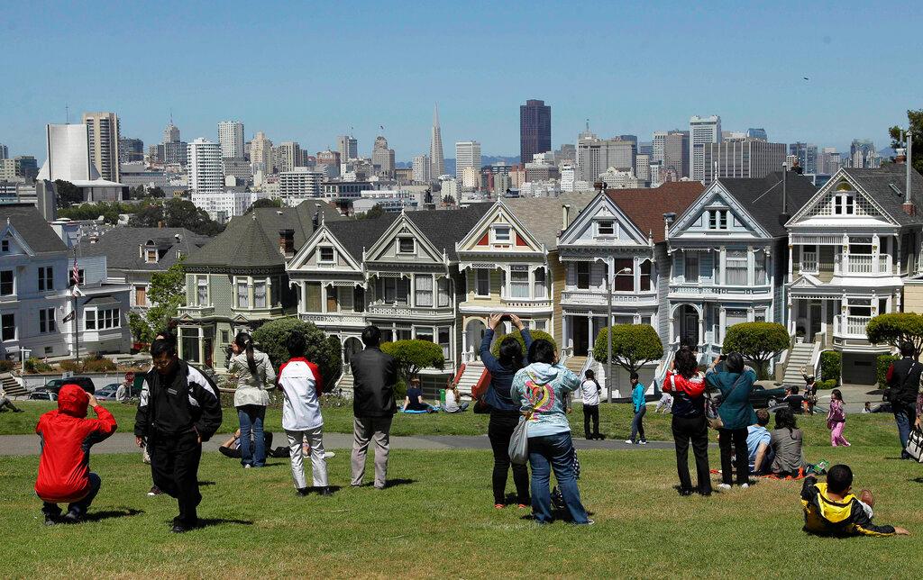 Tourists at park in front of homes from TV series "Full House"