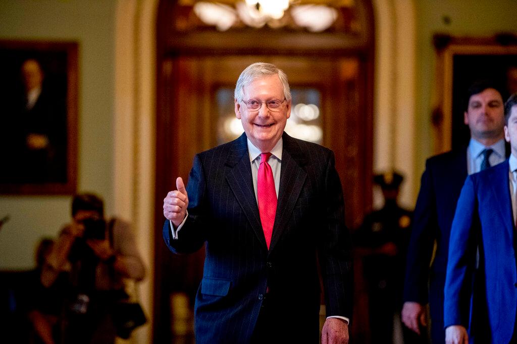 Senate Majority Leader Mitch McConnell of Ky. gives a thumbs up as he leaves the Senate chamber on Capitol Hill
