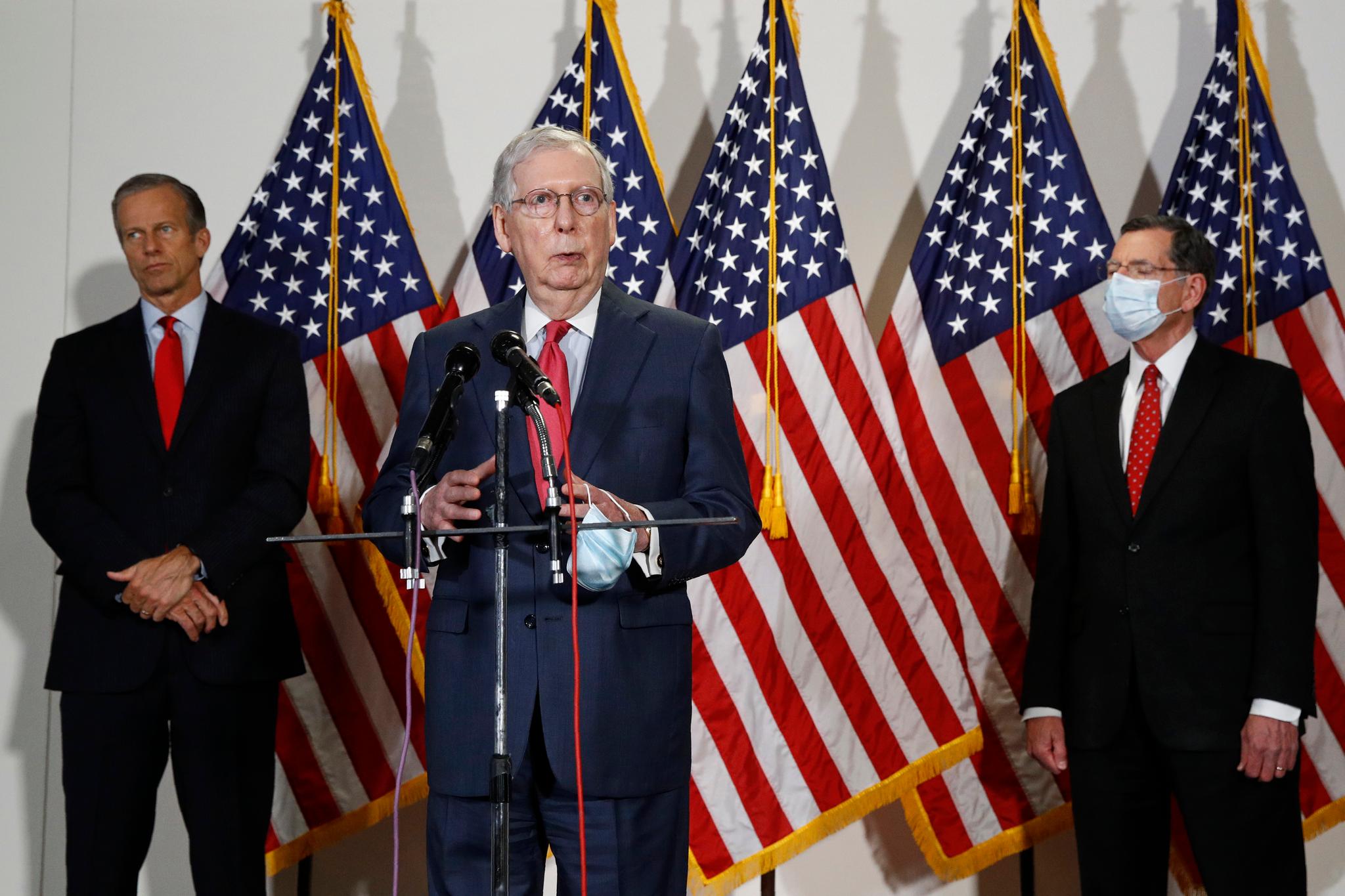 Senate Majority Leader Mitch McConnell speaks with reporters after meeting with Senate Republicans at weekly luncheon on Capitol Hill