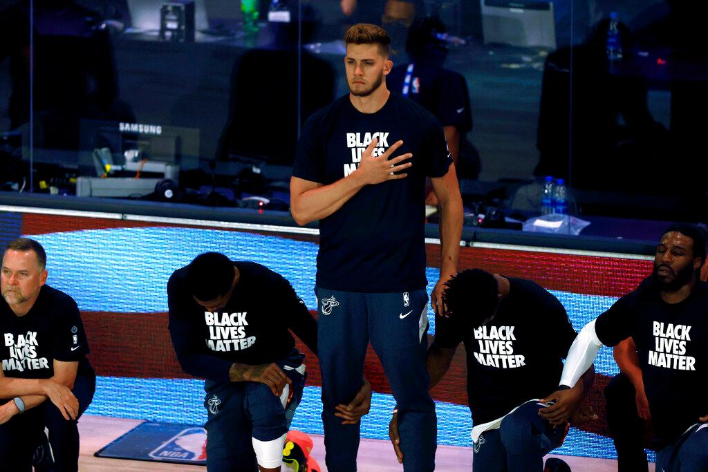 Miami Heat's Meyers Leonard stands during the national anthem before an NBA basketball game against the Denver Nuggets
