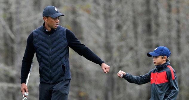 Tiger Woods fist bumping his son Charlie, 11-years-old