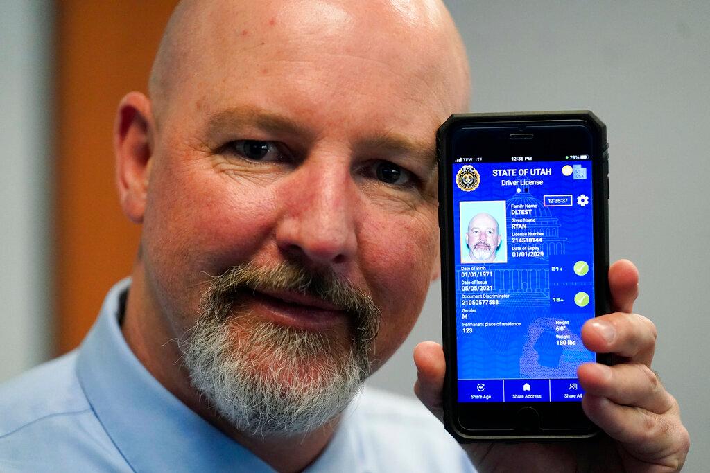 Ryan Williams, with the Utah Drivers License Division, displayes his cell phone with the pilot version of the state's mobile ID