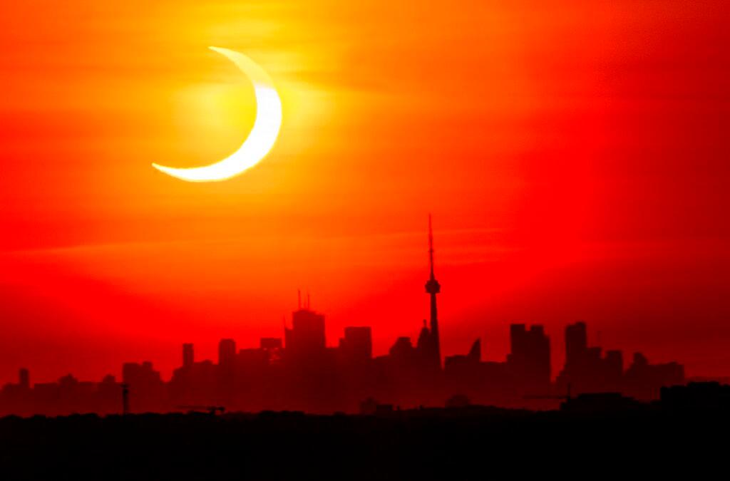 Solar Eclipse over Toronto Skyline 