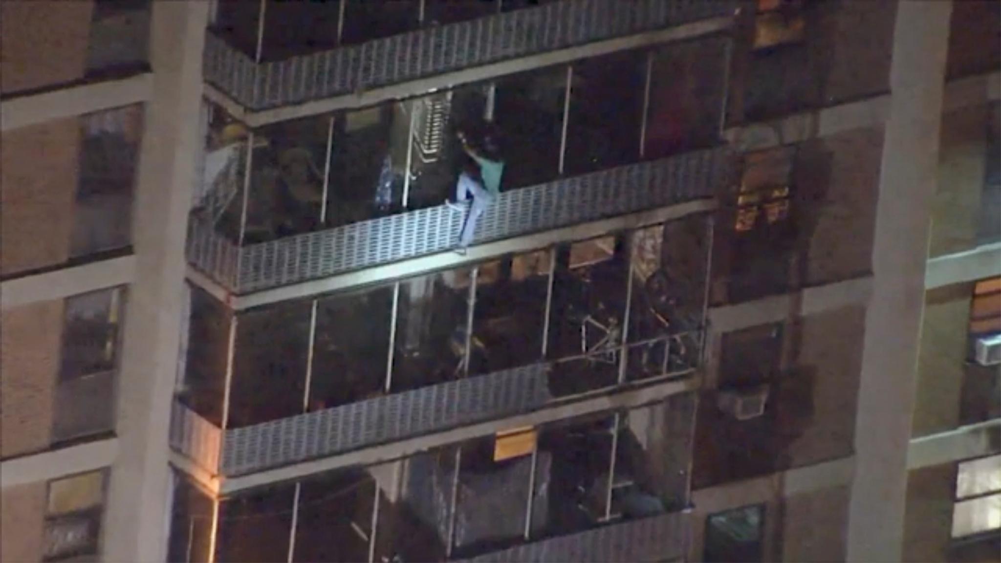 Man Scales High-Rise To Escape Fire