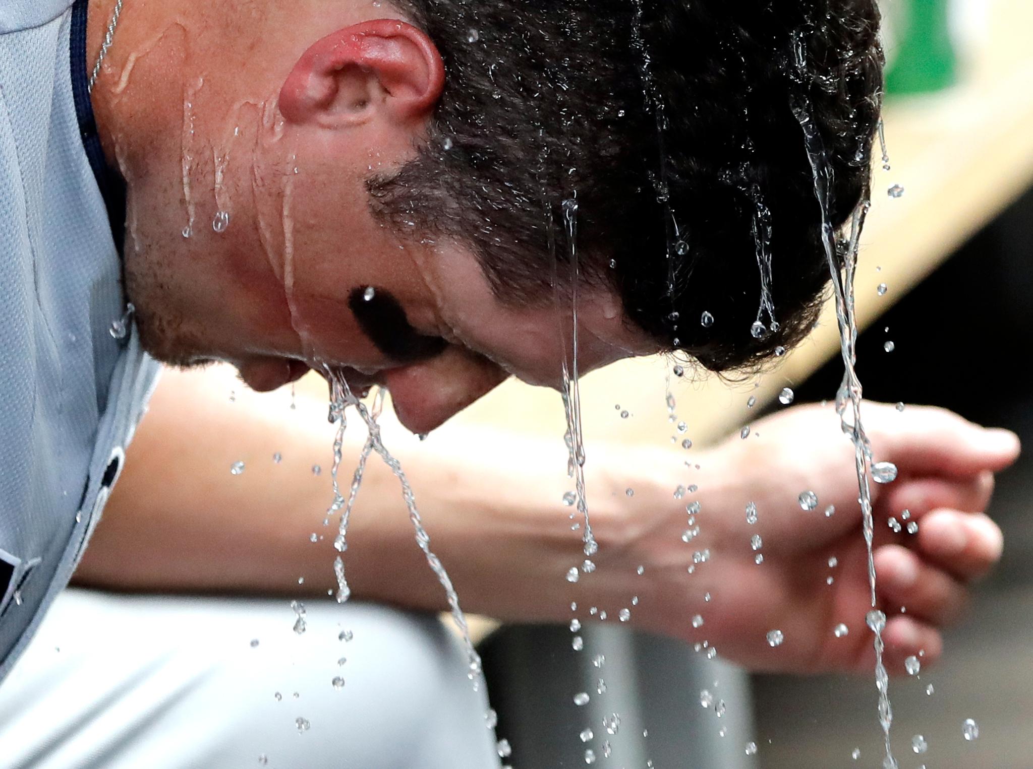 San Diego Padres' Hunter Renfroe cools off in the dugout