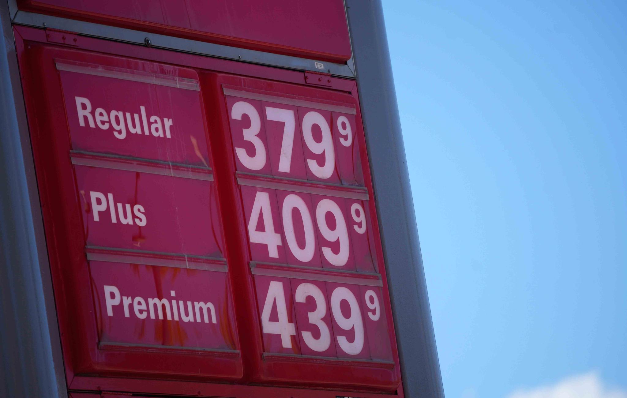  In this Oct. 24 2021, file photo, gas pump prices are posted on a sign at a Conoco station in southeast Denver.
