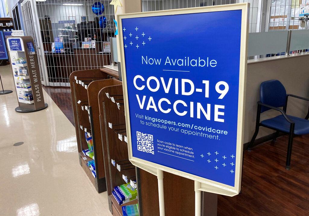 COVID-19 vaccinations are available at a pharmacy in a grocery store in Monument, Colo.