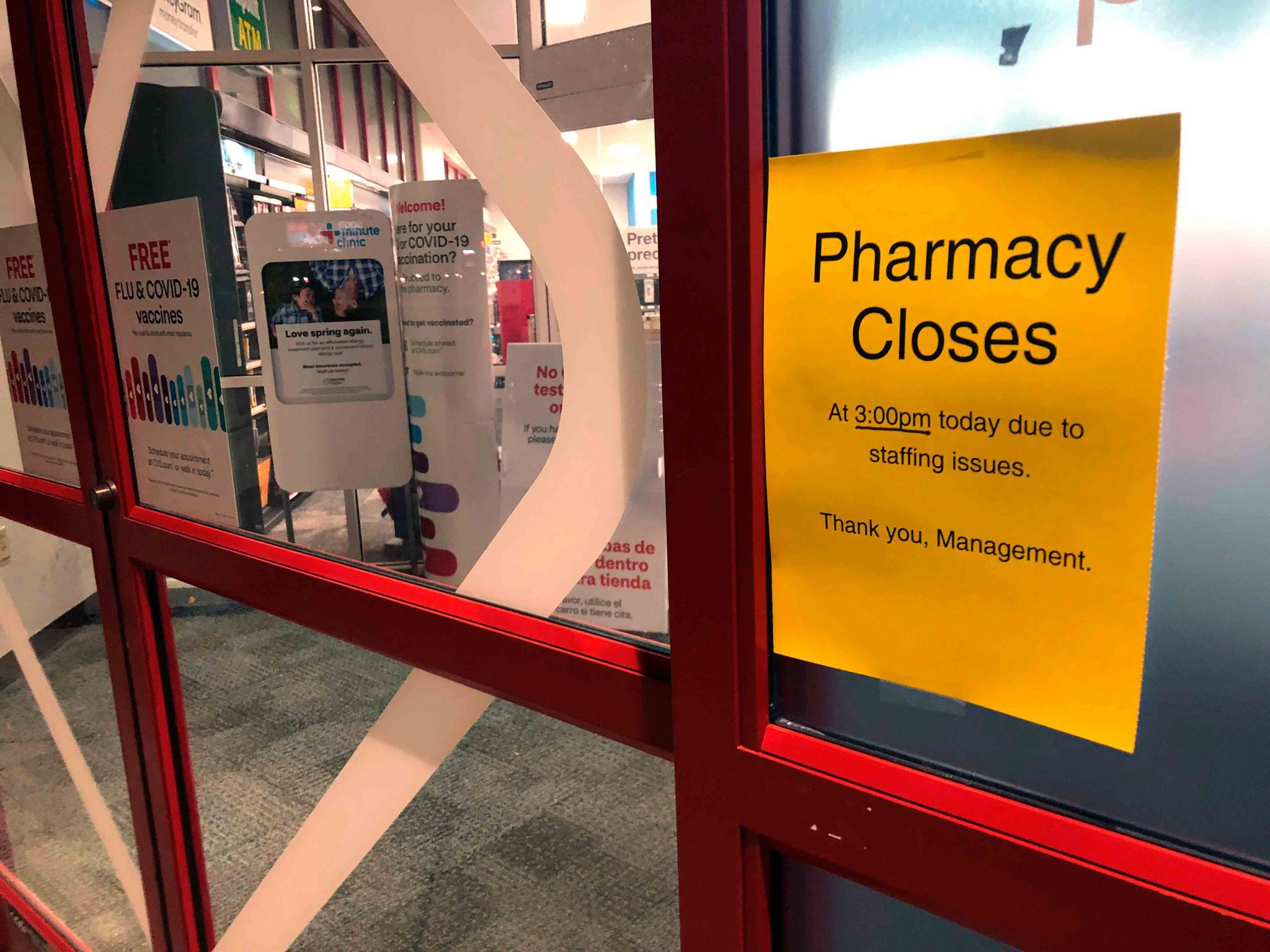 A sign is posted outside a CVS pharmacy on Thursday, Dec. 2, 2021 in Indianapolis.