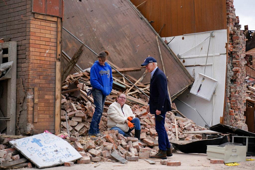President Joe Biden surveys storm damage from tornadoes and extreme weather in Mayfield, Ky.