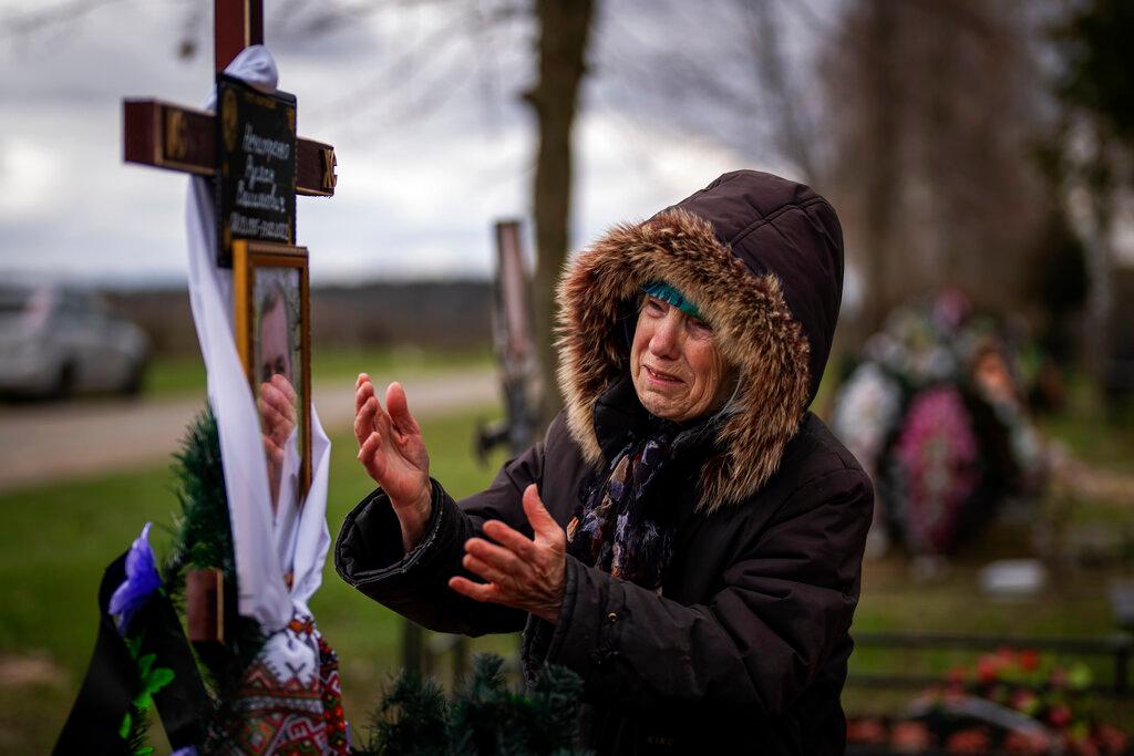 Ukraine: Valentyna Nechyporenko, 77, mourns at the grave of her 47-year-old son Ruslan