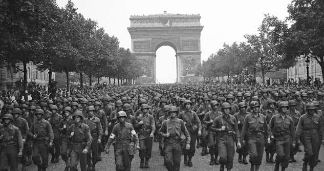 1944 US soldiers march in Paris after liberation of France
