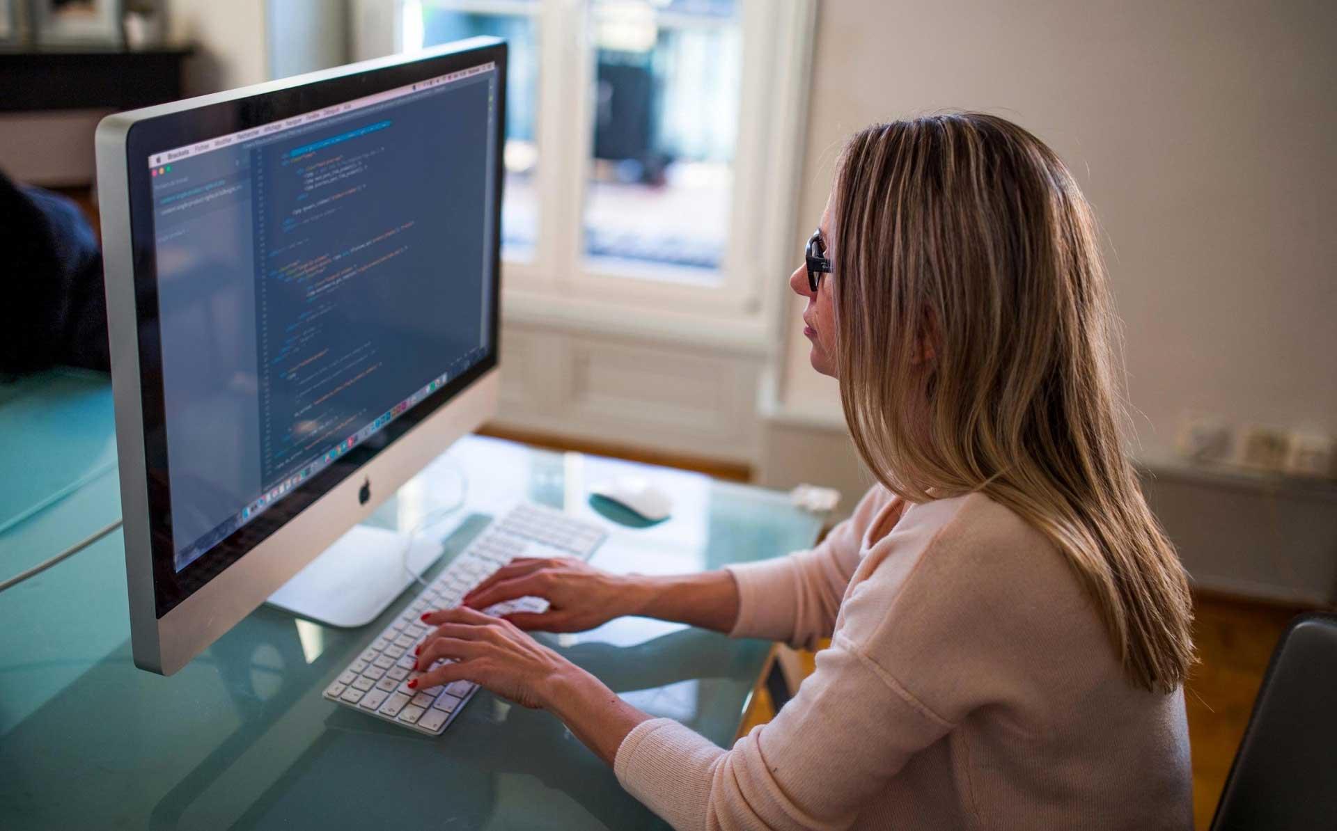 Woman working at computer screen