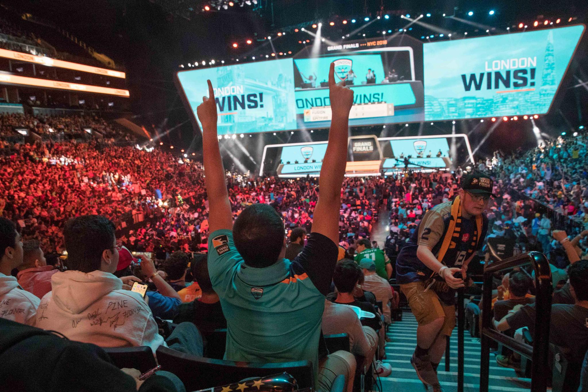 London Spitfire fan Rick Ybarra, of Plainfield, Ind., reacts after London won the second game against the Philadelphia Fusion during the Overwatch League Grand Finals competition at Barclays Center in New York